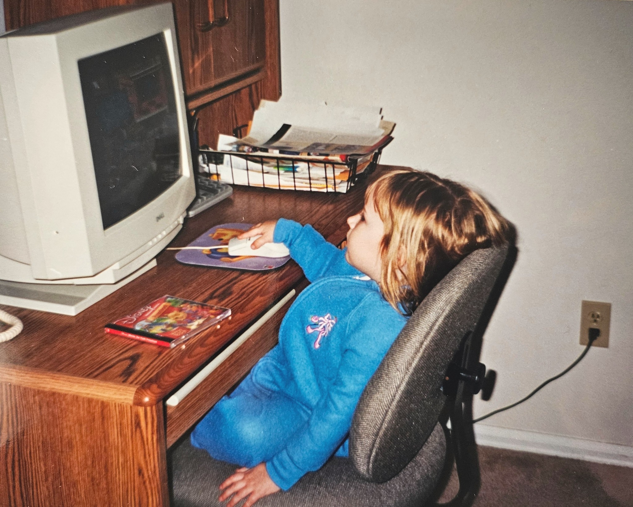 Mewizard as a young child, using a computer with a CRT monitor, and wearing a blue velvet tracksuit